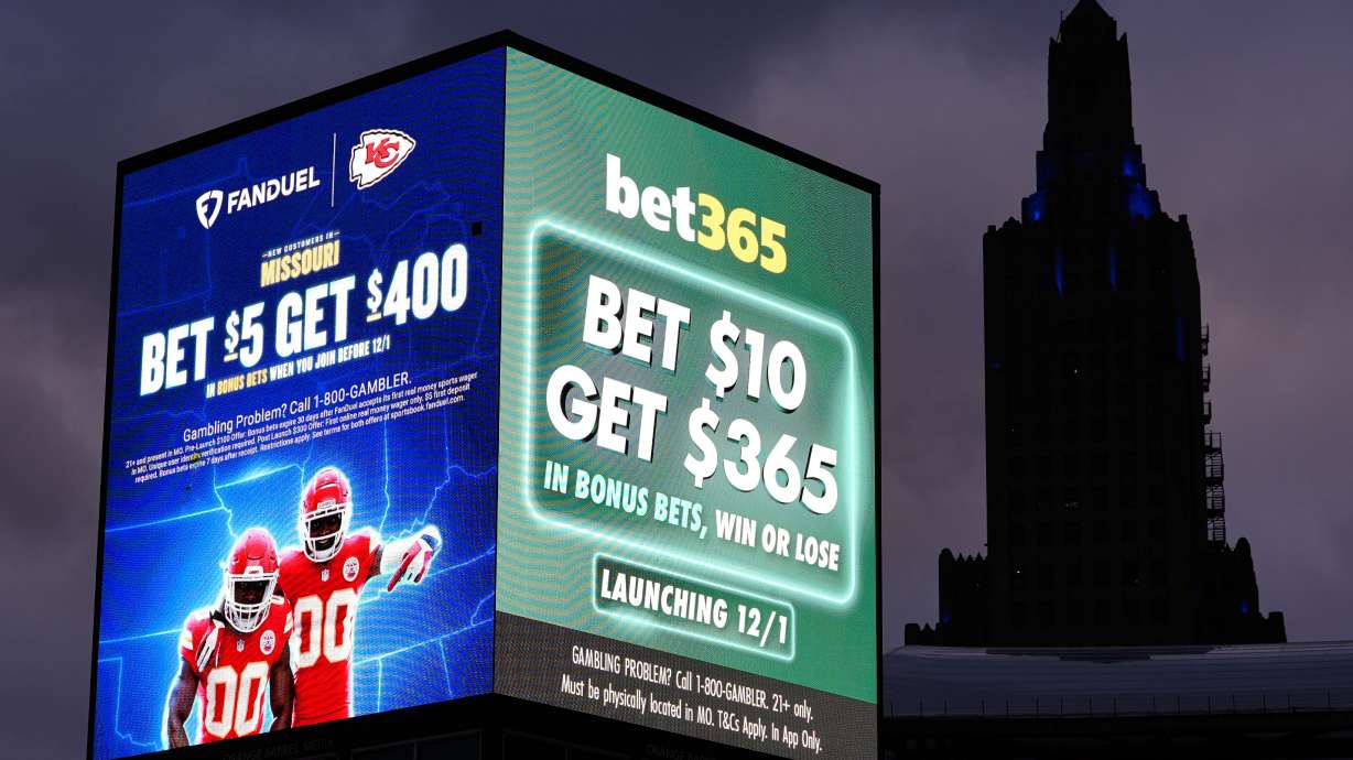 Advertisements for sports betting apps in downtown Kansas City, Mo., Nov. 29. A new Deseret News poll showed younger people and adults are driving an explosion of sports betting since the Supreme Court struck down a federal ban in 2018.
