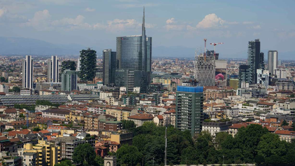 FILE — This photo shows Milan's CityLife district, including the city's tallest buildings, towering over housing architecture on June 26, 2021.