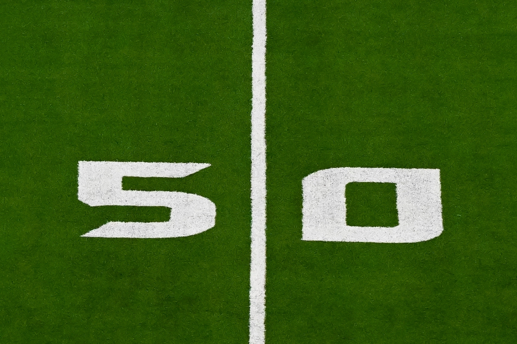 FILE - A detail view of the 50 yard line prior to an NFL football game between the Detroit Lions and the Houston Texans, Sunday, Nov 10, 2024 in Houston. 