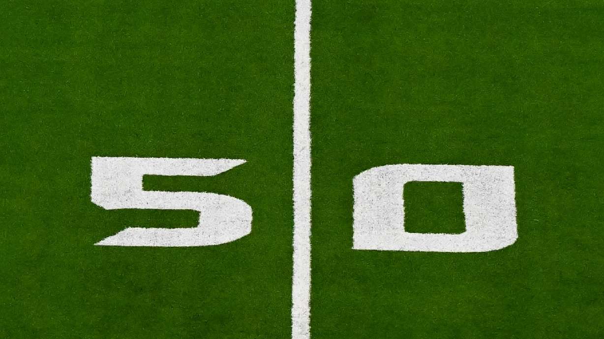 FILE - A detail view of the 50 yard line prior to an NFL football game between the Detroit Lions and the Houston Texans, Sunday, Nov 10, 2024 in Houston.