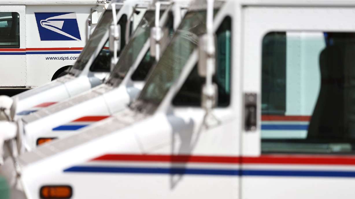 U.S. Postal Service trucks in Glendale, Calif., on Aug. 23, 2024. The postal service announced its holiday deadlines.