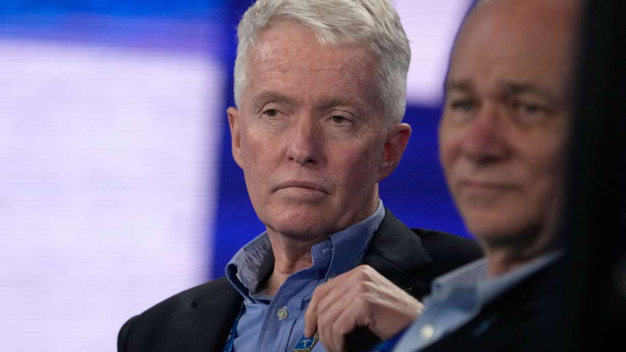 FILE - Australian Open tournament director Craig Tiley watches the fourth round match between Stefanos Tsitsipas of Greece and Jannik Sinner of Italy at the Australian Open tennis championship in Melbourne, Australia, Jan. 22, 2023.