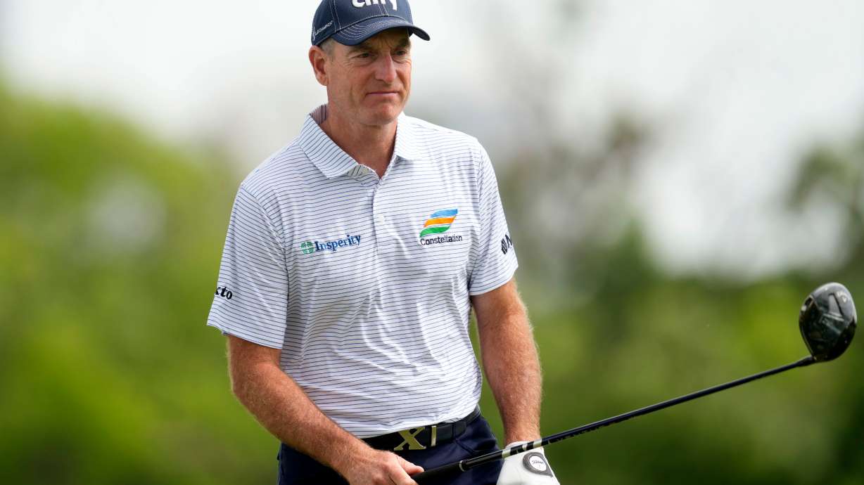 FILE - Jim Furyk lines up his shot on the third tee during the final round of the Champions Tour Principal Charity Classic golf tournament, June 2, 2024, in Des Moines, Iowa.