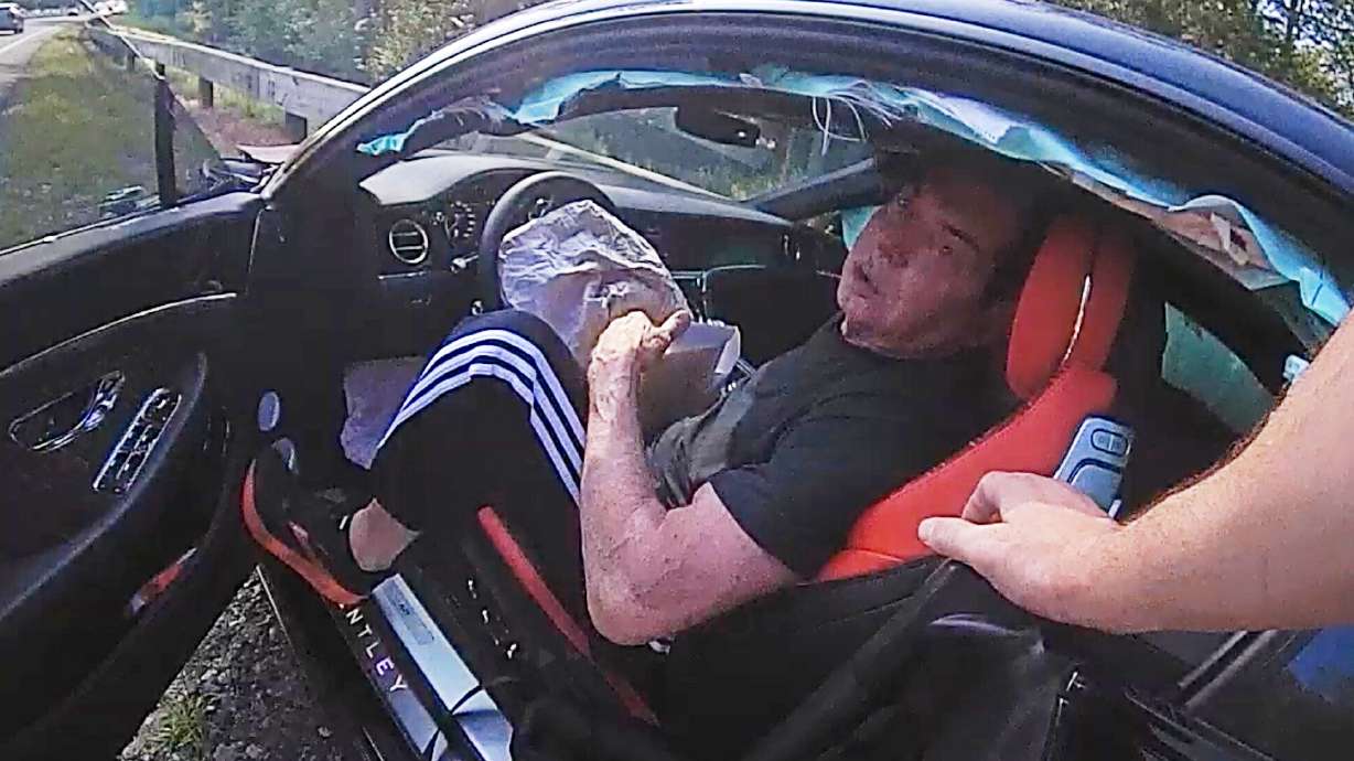 In an image taken from Connecticut State Police police bodycam video, Vince McMahon is questioned in his car after an accident on July 24, 2025, in Westport, Conn.