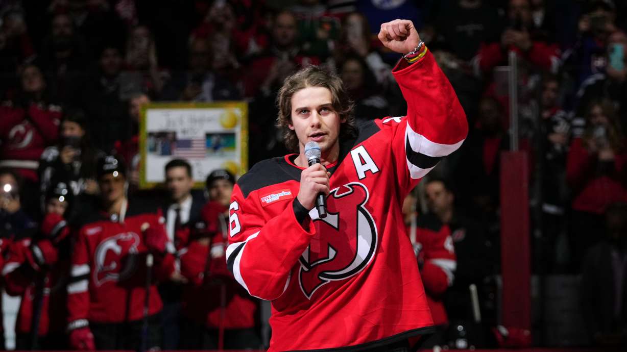 New Jersey Devils' Jack Hughes (86) speaks to fans before an NHL hockey game against the Buffalo Sabres Wednesday, Feb. 25, 2026, in Newark, N.J.