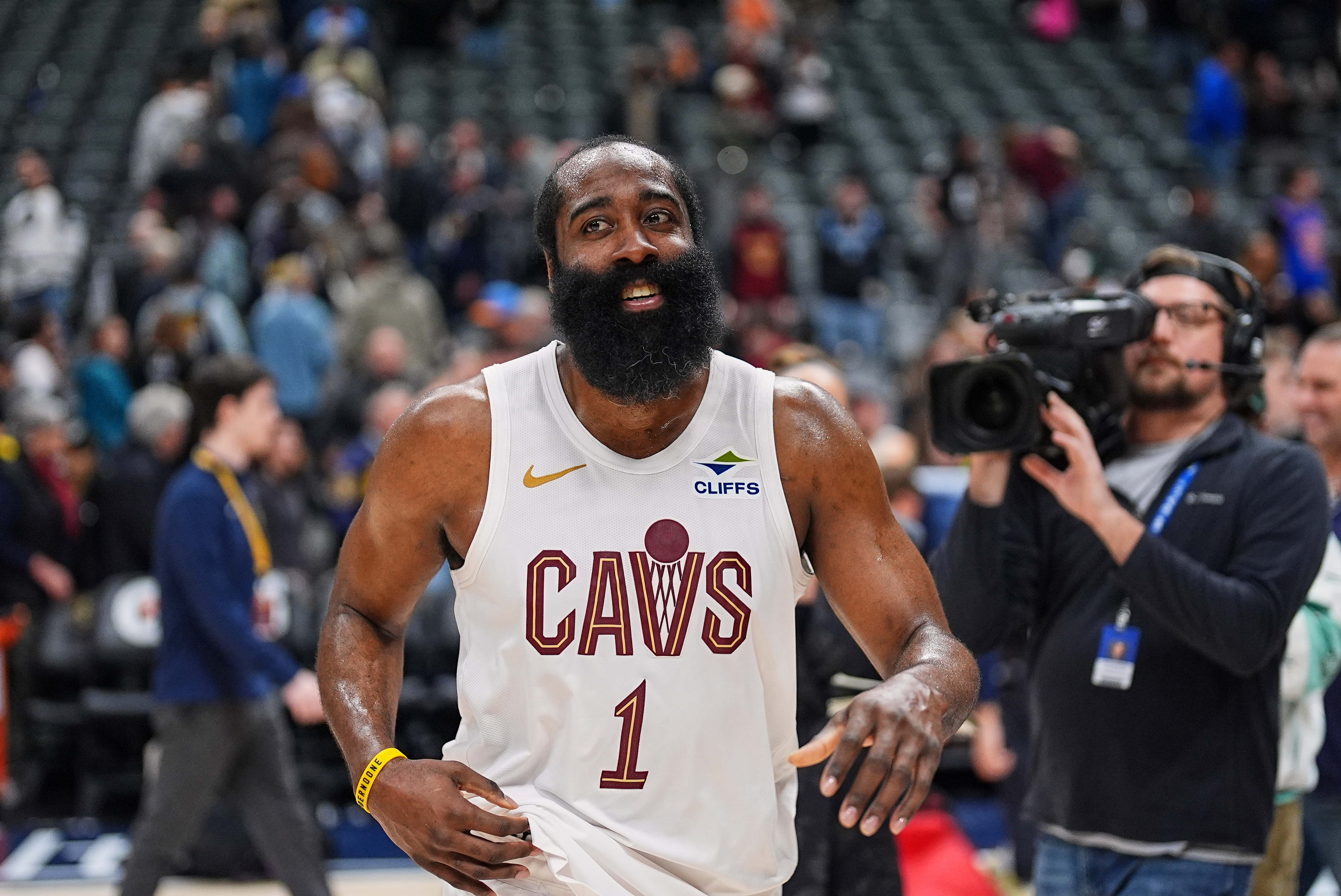 Cleveland Cavaliers guard James Harden smiles as he heads off the court after being interviewed following the Cavaliers' victory over the Denver Nuggets in an NBA basketball game Monday, Feb. 9, 2026, in Denver.