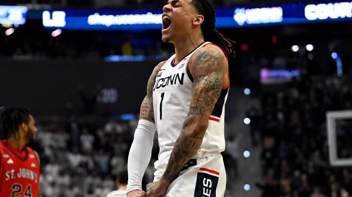 UConn guard Solo Ball reacts in the first half of an NCAA college basketball game against St. John's, Wednesday, Feb. 25, 2026, in Hartford, Conn.