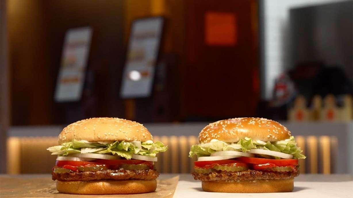 Burger King unveiled its enhanced Whopper on Thursday, which includes a new bun, mayonnaise and is served in a box, after customers complained about the older version on the left.