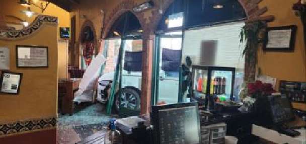Elderly woman arrested after crashing into Sandy restaurant, police say