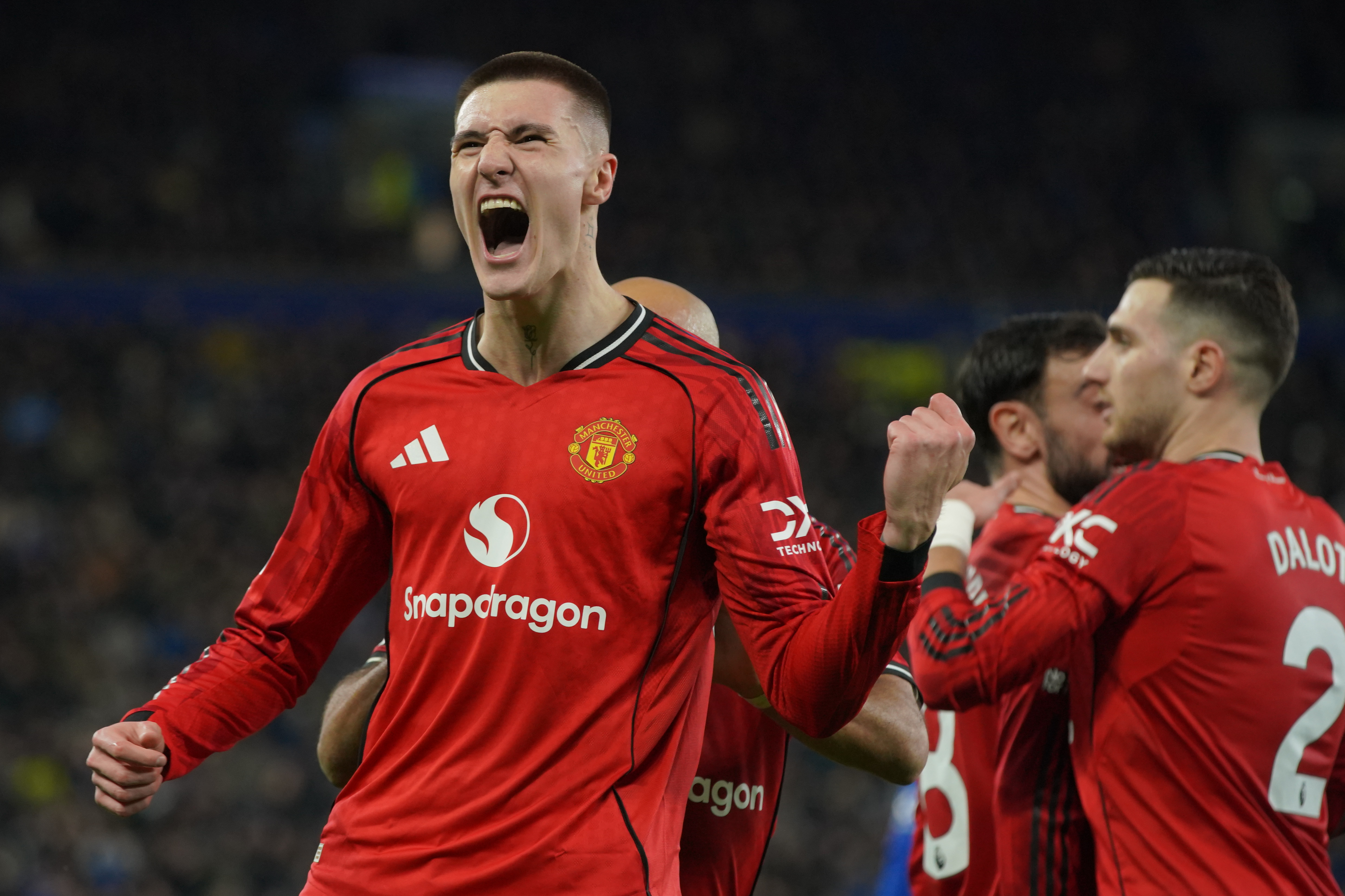 Manchester United's Benjamin Sesko celebrates after scoring during the Premier League soccer match between Manchester United and Everton in Liverpool, England, Monday, Feb. 23, 2026.