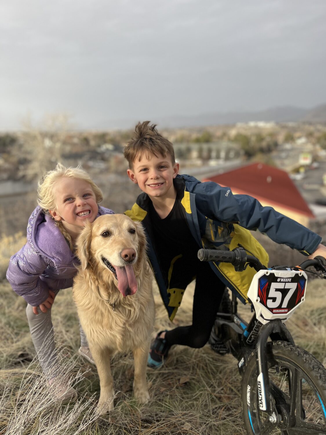 Brian O'Keefe's children and his golden retriever, Maggie. O'Keefe was killed in an avalanche in Midway on Sunday.