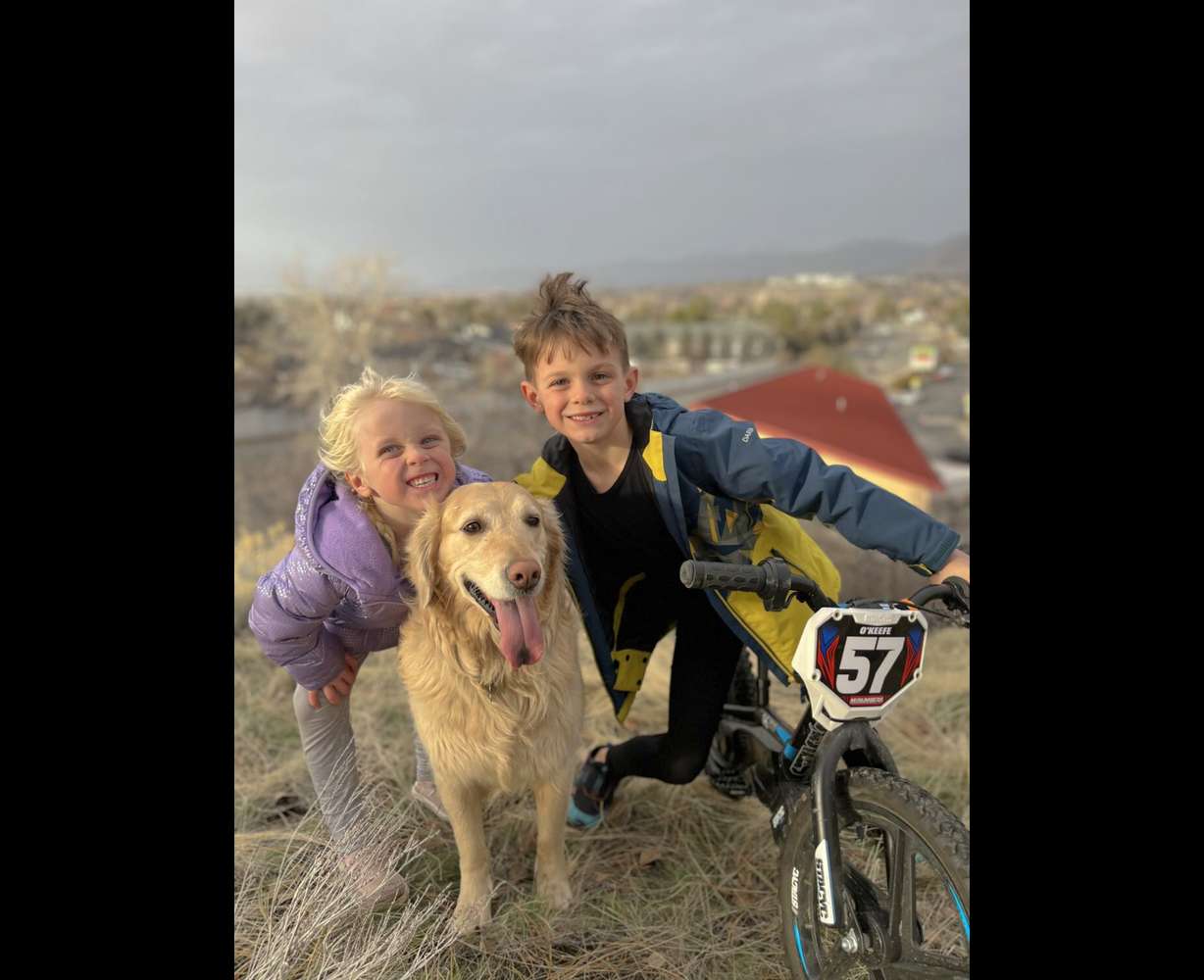 Brian O'Keefe's children and his golden retriever, Maggie. O'Keefe was killed in an avalanche in Midway on Sunday.