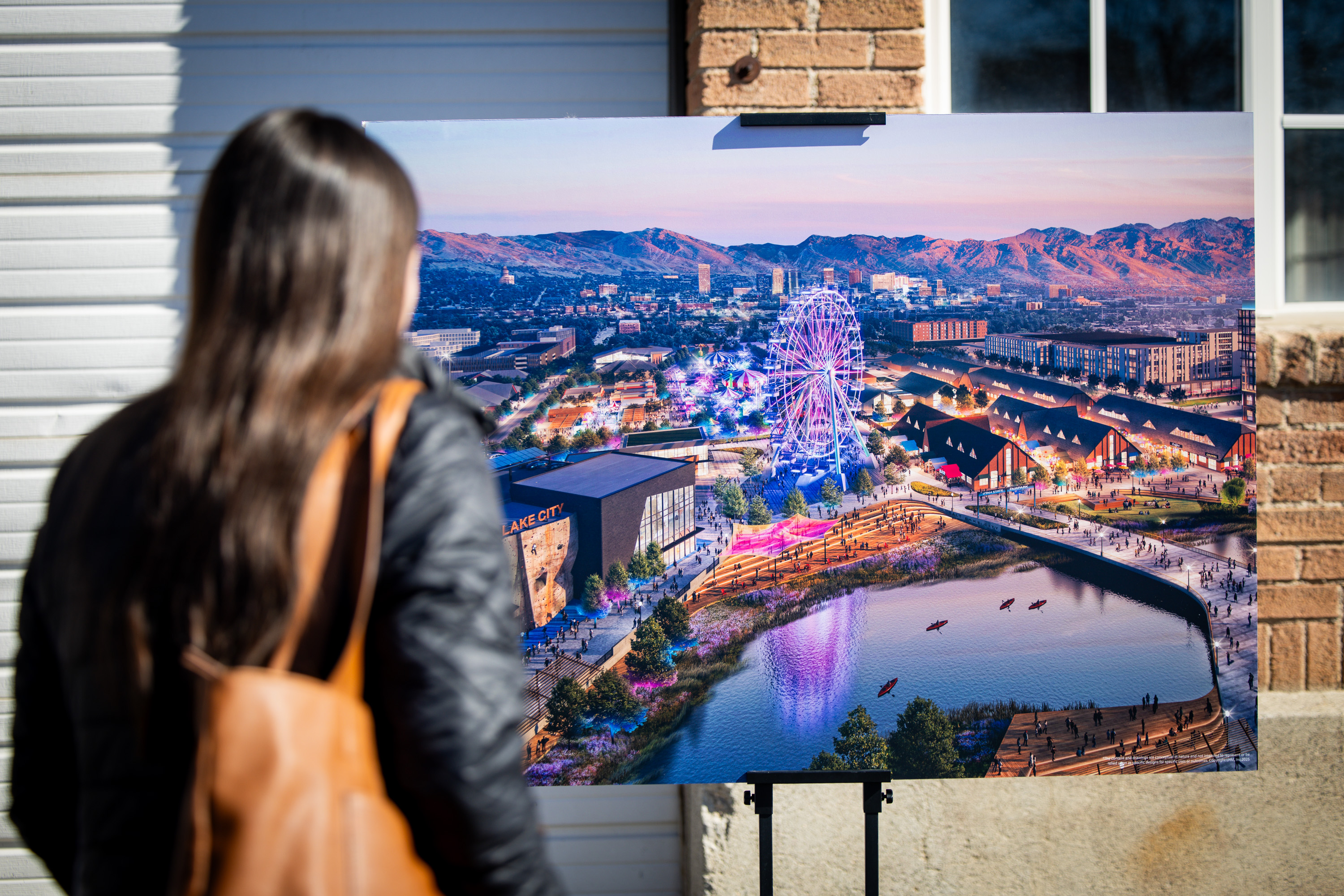 An attendee looks at a rendering before a press conference where community leaders are celebrating the launch of a community-driven plan to revitalize a half-mile stretch of the Jordan River at the Utah State Fairpark in Salt Lake City on Thursday.