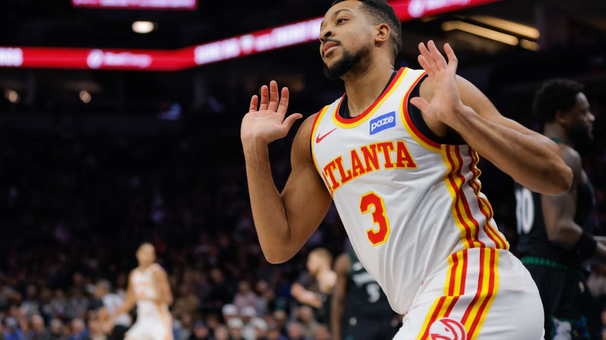 Atlanta Hawks guard CJ McCollum (3) celebrates after dunking during the first half of an NBA basketball game against the Minnesota Timberwolves, Monday, Feb. 9, 2026, in Minneapolis.
