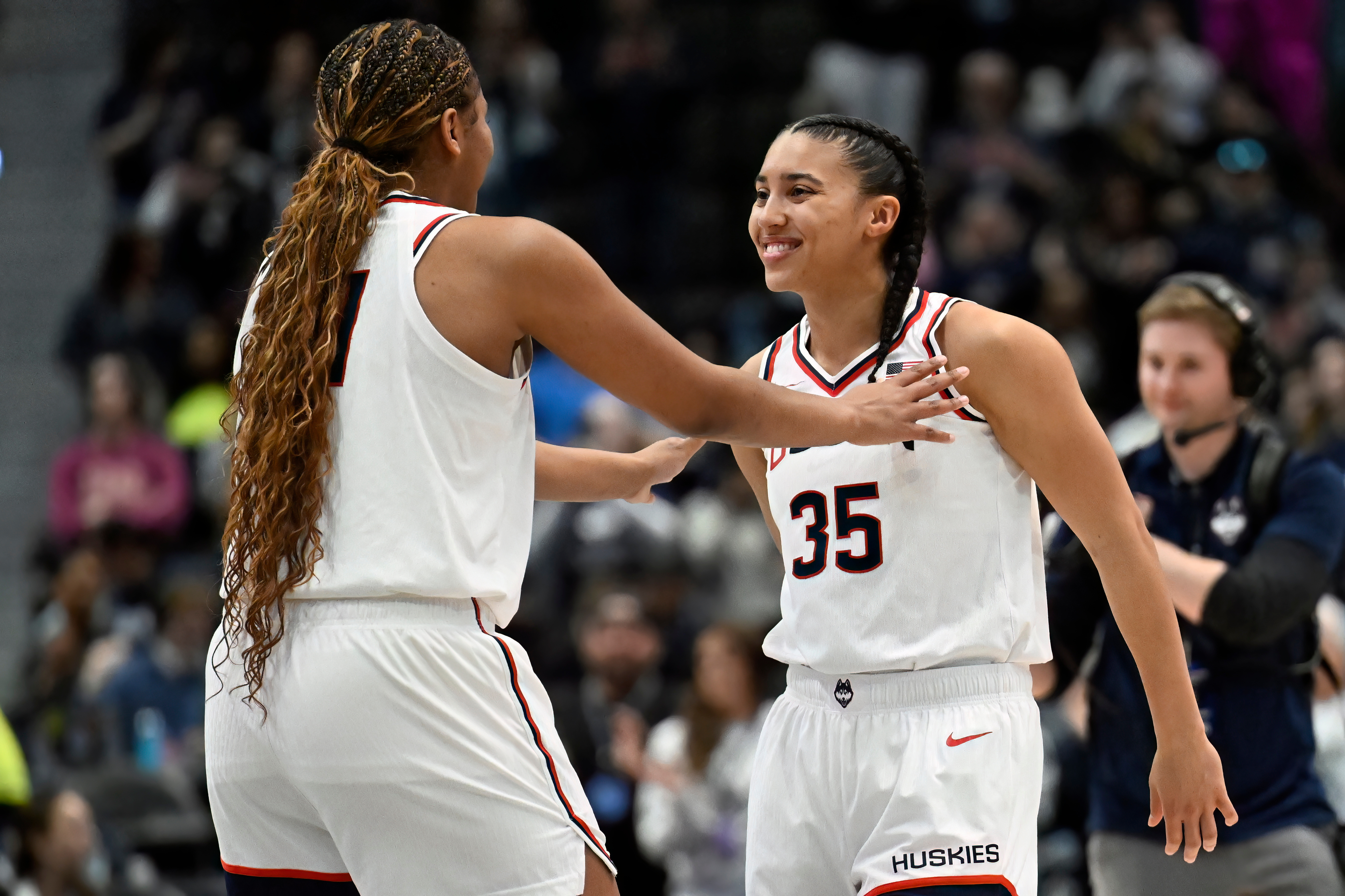 UConn forward Sarah Strong, left, talks with UConn guard Azzi Fudd, right, before tip off in an NCAA college basketball game against Georgetown, Thursday, Feb. 26, 2026, in Hartford, Conn. 