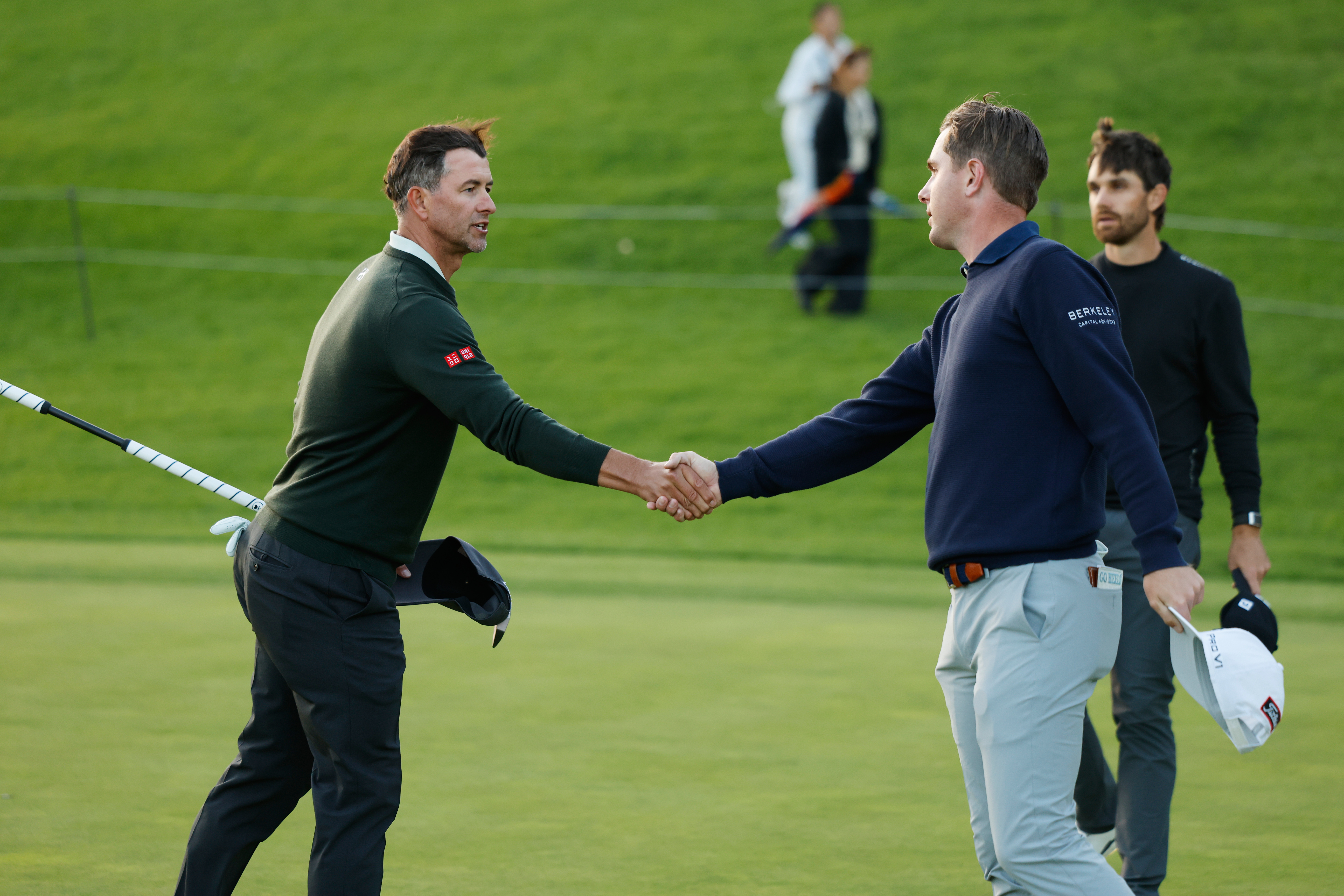Adam Scott, from Australia, left, shakes hands with Ryan Gerard after finishing the first round of the Genesis Invitational golf tournament at Riviera Country Club, Thursday, Feb. 19, 2026, in the Pacific Palisades area of Los Angeles. 