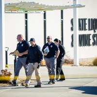 Suspected gunman shot by police at liquor store tied to apparent road rage incident