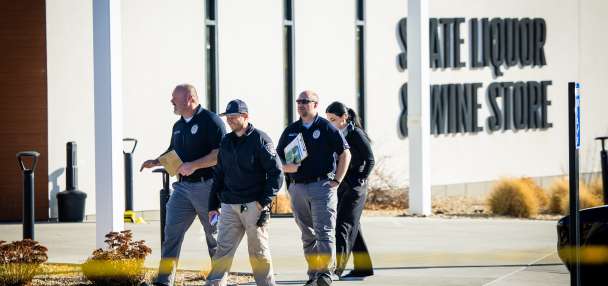 Suspected gunman shot by police at liquor store tied to apparent road rage incident