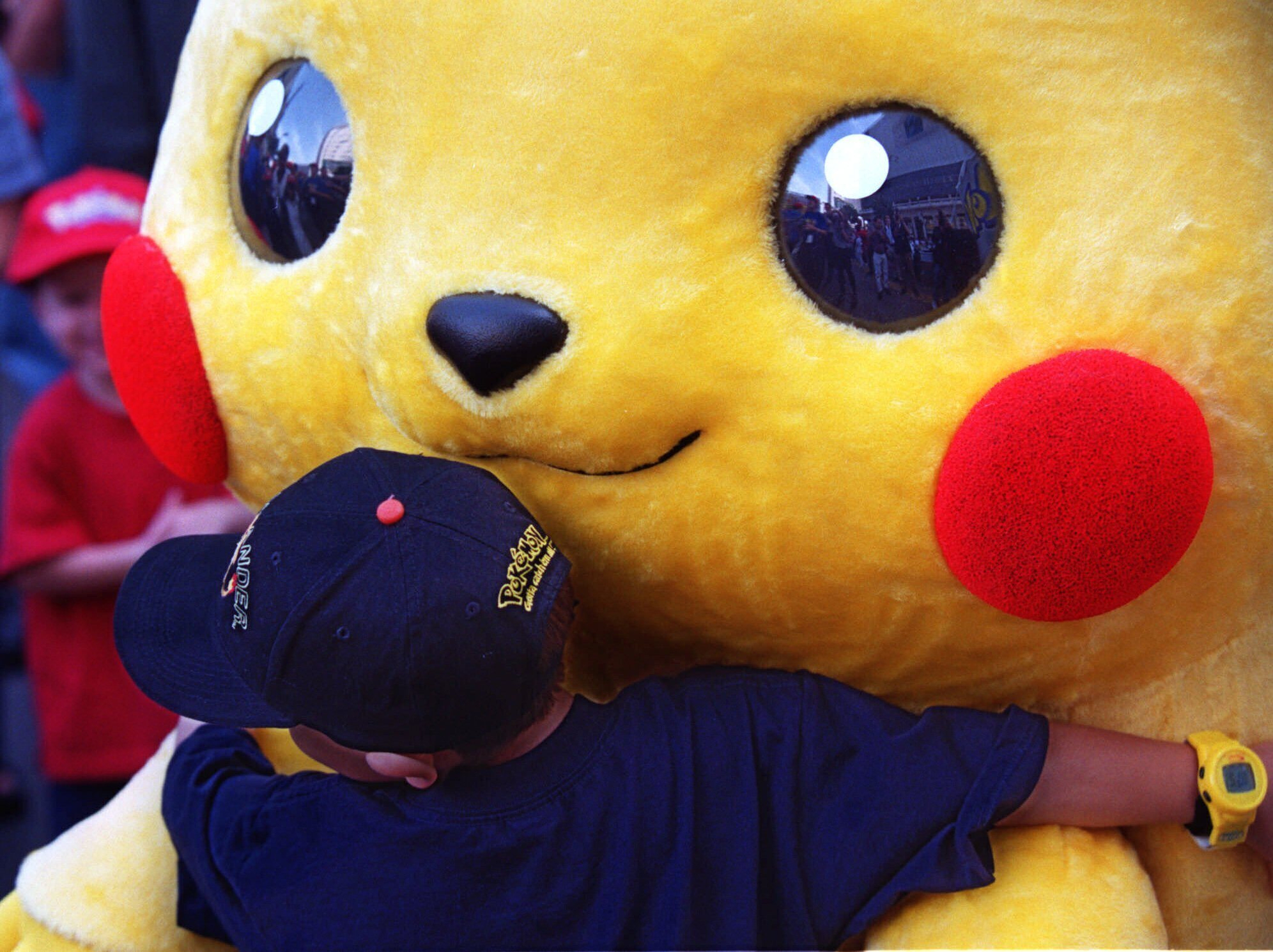 Daniel Osugi, 7, of Long Beach, Calif., hugs an oversized Pokémon character known as "Pikachu" at the premiere of the new Warner Bros. animated feature, "Pokémon The First Movie," Nov. 6, 1999, at the Mann's Chinese Theatre, in Los Angeles.