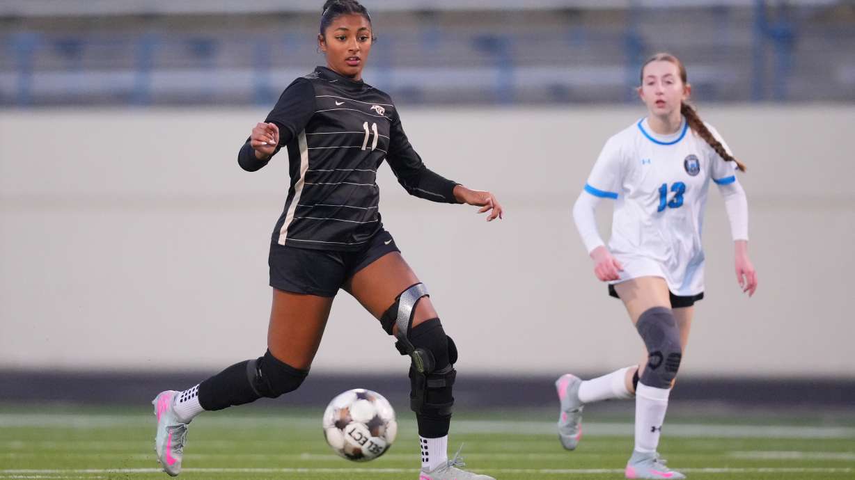 Plano East varsity soccer player Aliya Jacob, left, controls the ball against Rock Hill's Hanna Schinner during a soccer game, Jan. 30, 2026, in Murphy, Texas.