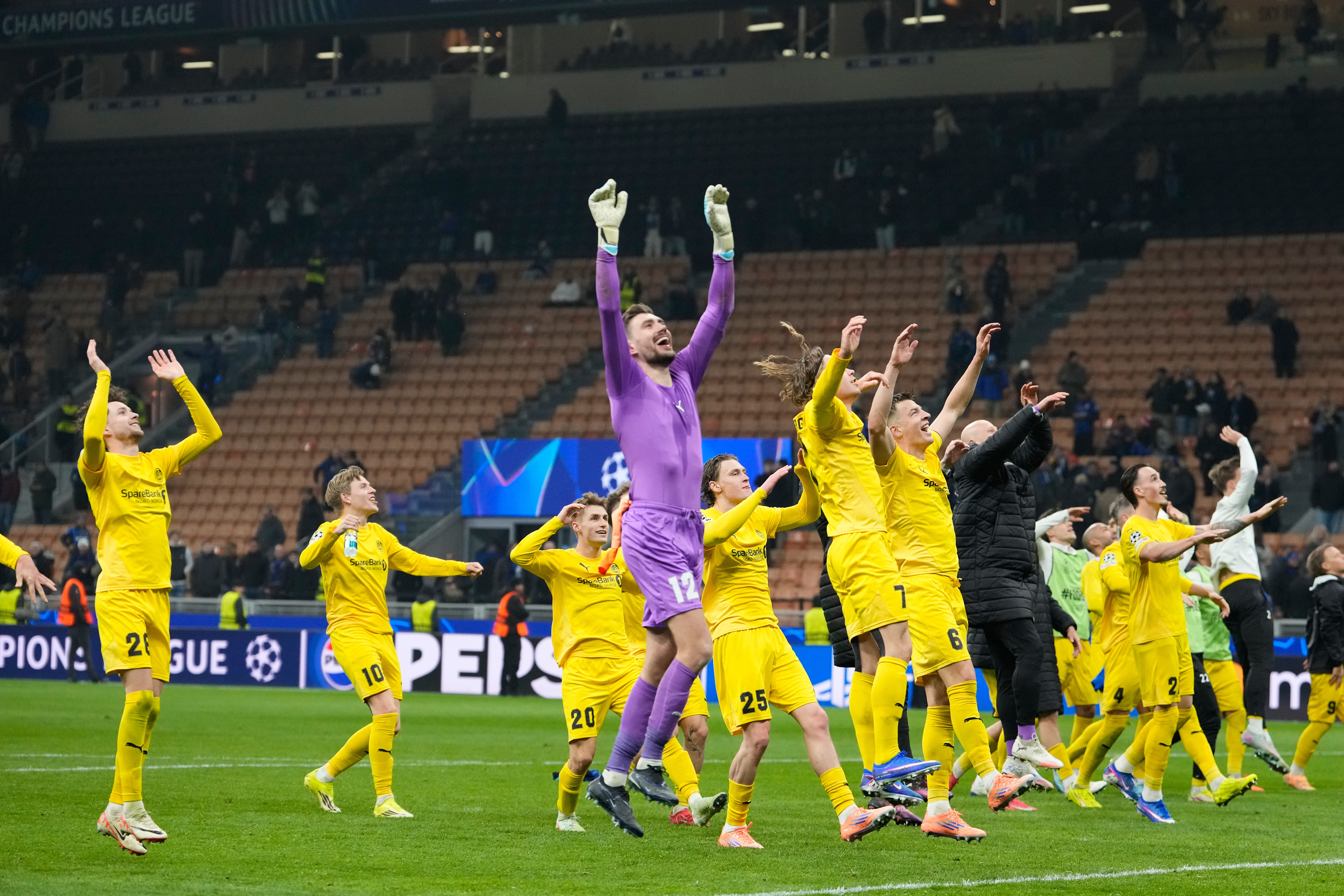 Glimt's players celebrate at the end of the Champions League playoff soccer match between Inter Milan and Bodo Glimt, at the San Siro stadium in Milan, Italy, Tuesday, Feb.24, 2026. 
