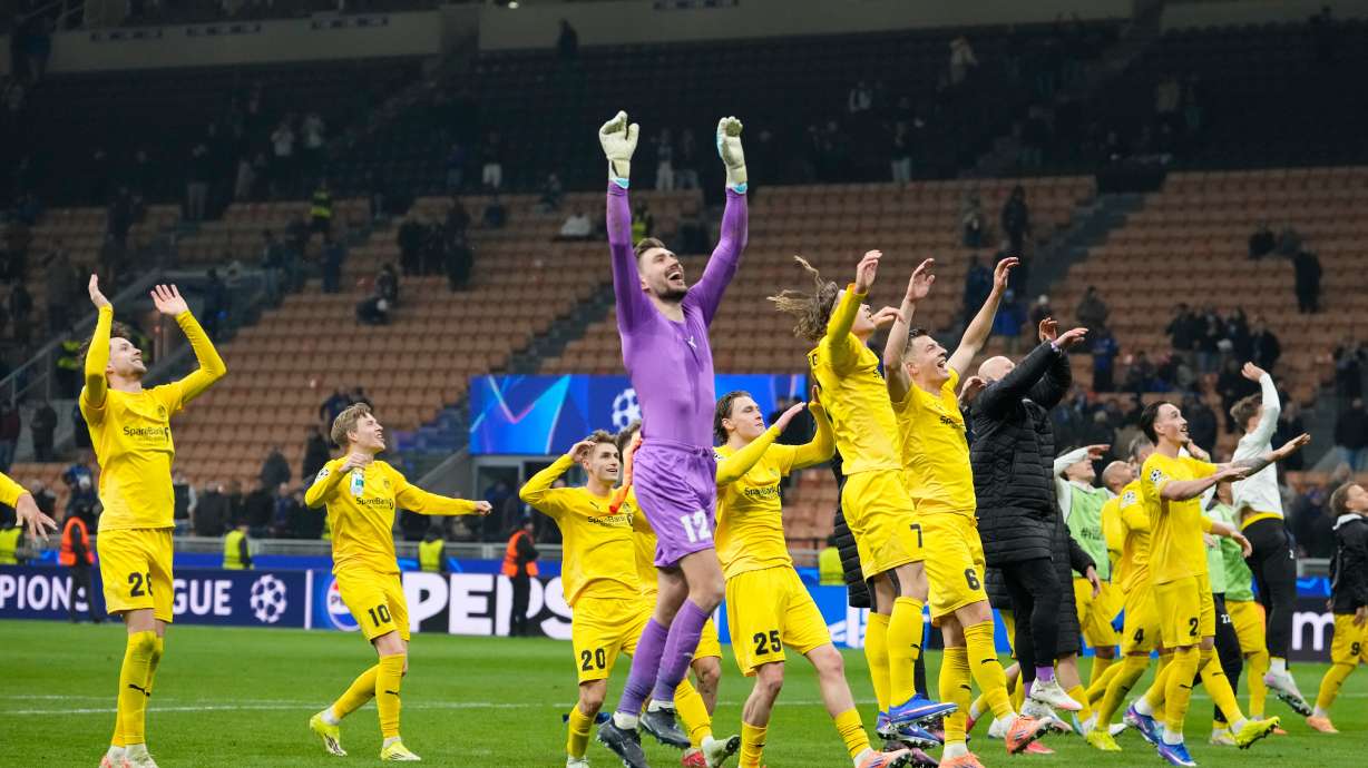 Glimt's players celebrate at the end of the Champions League playoff soccer match between Inter Milan and Bodo Glimt, at the San Siro stadium in Milan, Italy, Tuesday, Feb.24, 2026.
