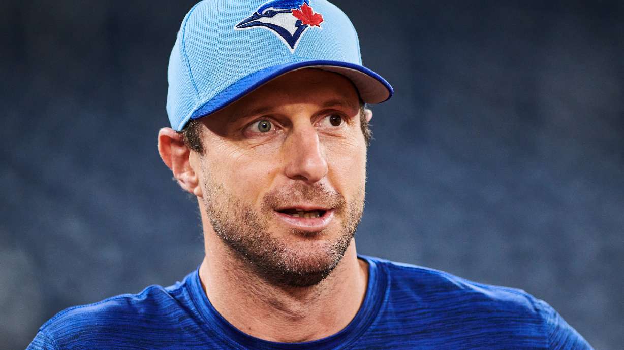 FILE - Toronto Blue Jays' Max Scherzer (31) looks on before batting practice Saturday, Oct. 18, 2025, in Toronto, a day ahead of Game 6 in baseball's American League Championship Series against the Seattle Mariners.