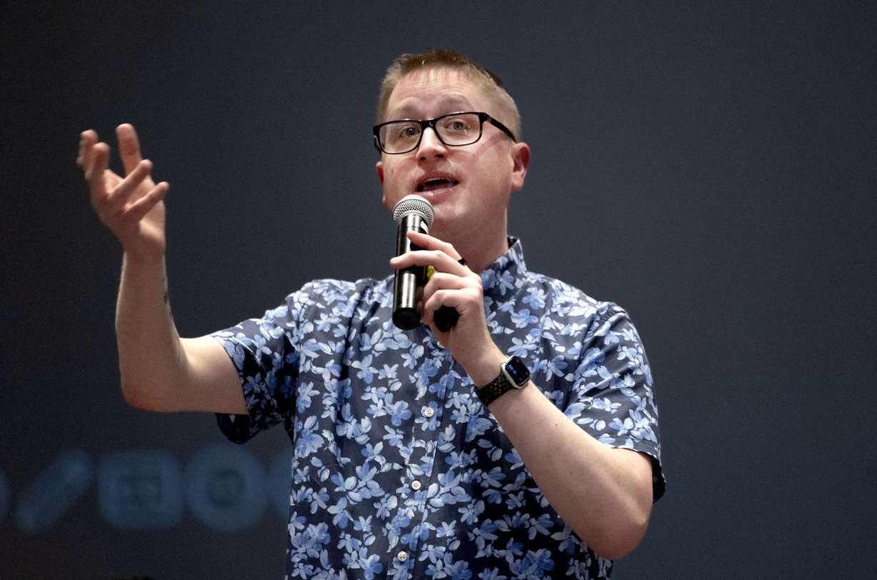 Author John Schu speaks to students during Operation Literacy at Bryant Middle School in Salt Lake City on Friday. Hundreds of Salt Lake City School District students received free books as part of the book drop event.