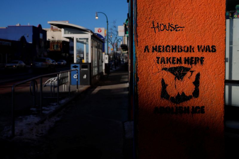 A sign on a wall reads "A Neighbor Was Taken Here," indicating a place where someone was detained by federal immigration agents, in Minneapolis, Minn., Jan. 30. A new report showed businesses were struggling in Minnesota due to immigration crackdowns.