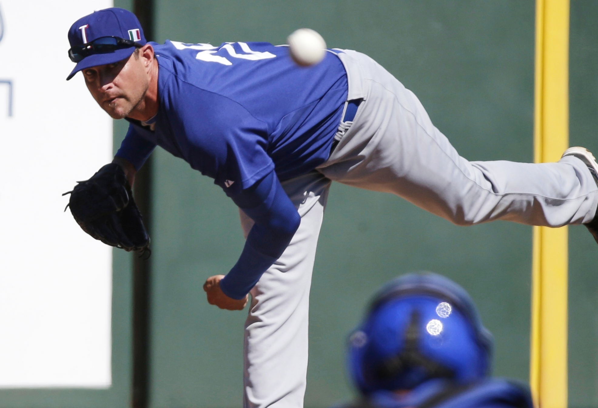FILE - Italy's Dan Serafini throws before the first inning of an exhibition spring training baseball game against the Los Angeles Angels Wednesday, March 6, 2013, in Tempe, Ariz. 
