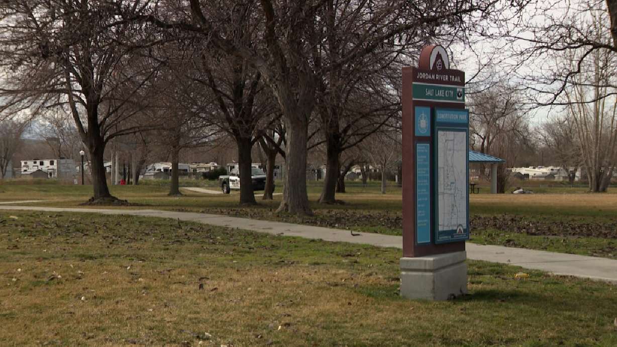A man who allegedly assaulted a woman he did not know who was running along the Jordan River Trail has been arrested.