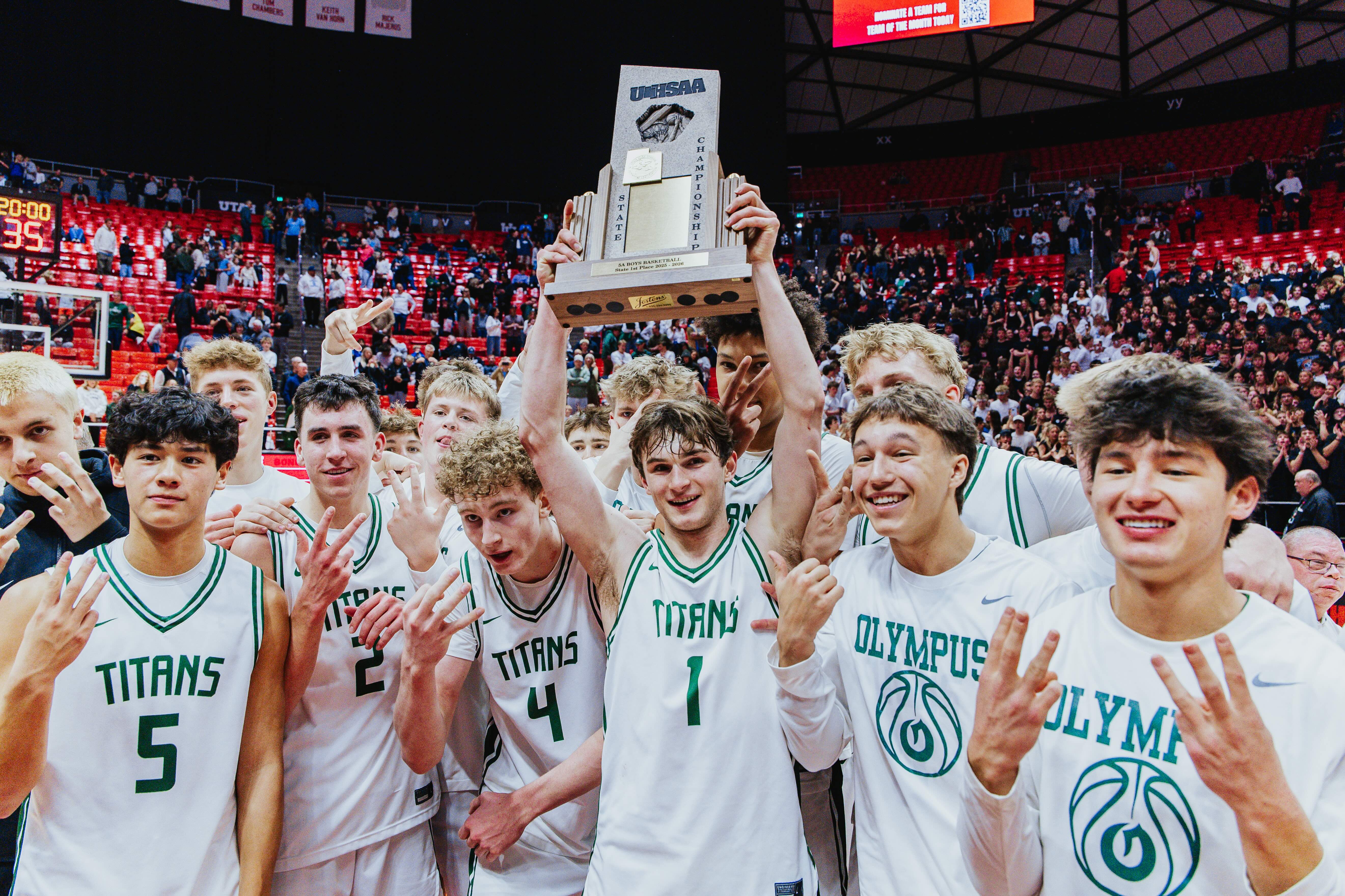 Olympus' Gavin Lowe (1) hoists the trophy after winning the 5A boys basketball championship against Bountiful, Friday, Feb. 27, 2026 at the Huntsman Center in Salt Lake City, Utah.