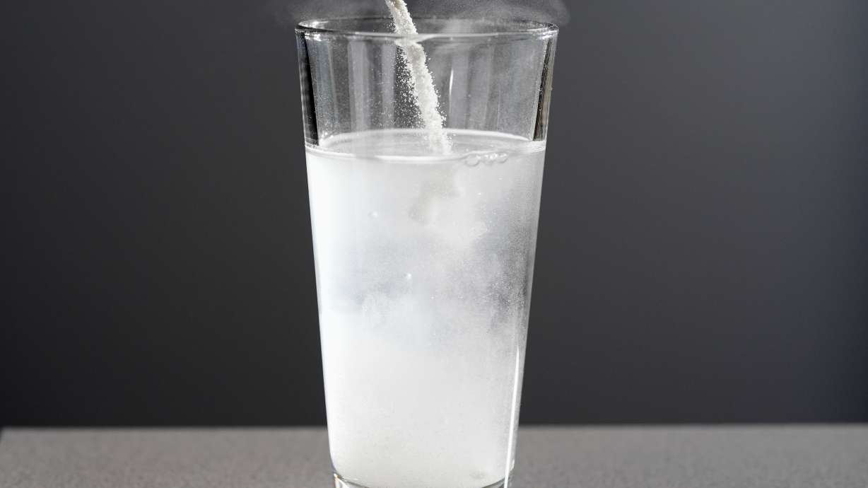 Electrolyte supplements are poured into glass of water Tuesday, Feb. 24, 2026, in Nashville, Tenn.