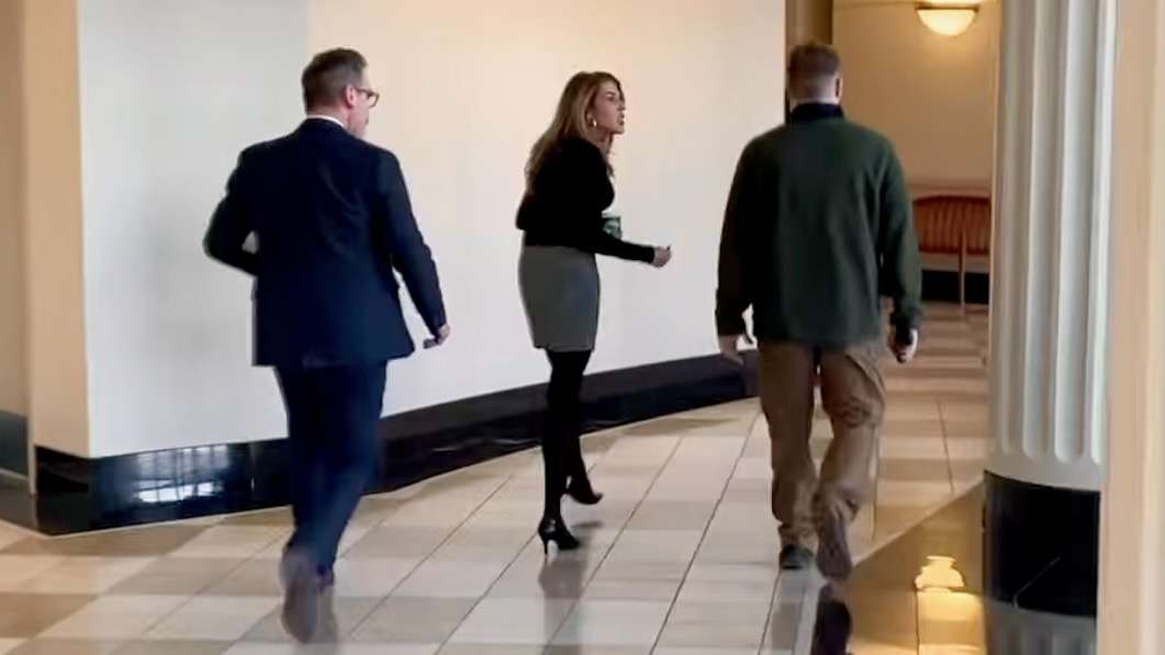 U.S. agents have ratcheted up immigration enforcement action at Utah courthouses, prompting criticism from some. The photo shows attorney Lacey Singleton, center, questioning a suspected agent recently at Matheson Courthouse in Salt Lake City.