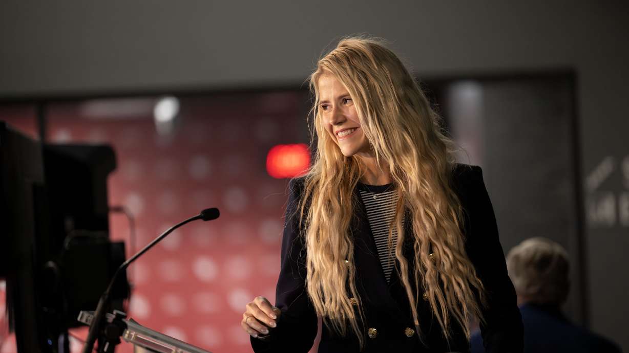 Elizabeth Smart steps to the poduim to speak on the prevalence of childhood trauma, as well as statistics specific to the state of Utah. Such as 1 in 3 women in the state of Utah will experience sexual violence in their lifetime as GenerationAl’s Healing Generations holds a free event at Rice-Eccles Stadium at The University of Utah in Salt Lake City, Oct. 14, 2025