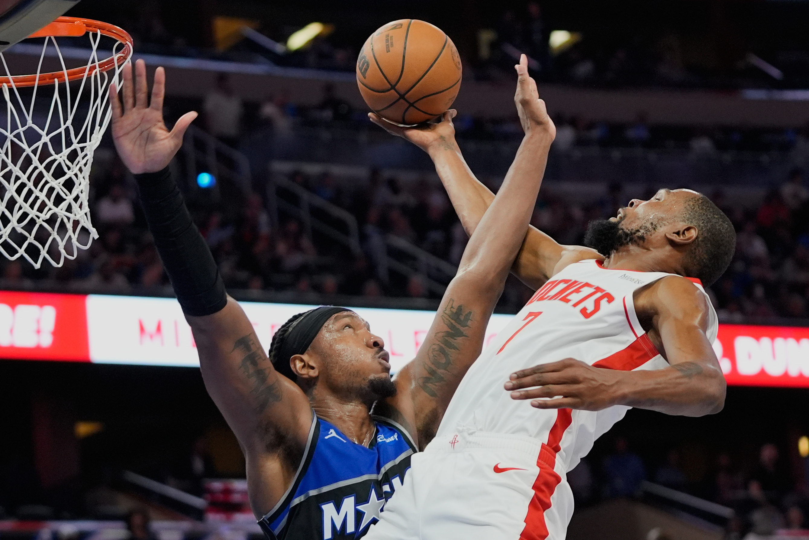 Houston Rockets forward Kevin Durant, right, goes to the basket against Orlando Magic center Wendell Carter Jr. during the second half of an NBA basketball game, Thursday, Feb. 26, 2026, in Orlando, Fla. 
