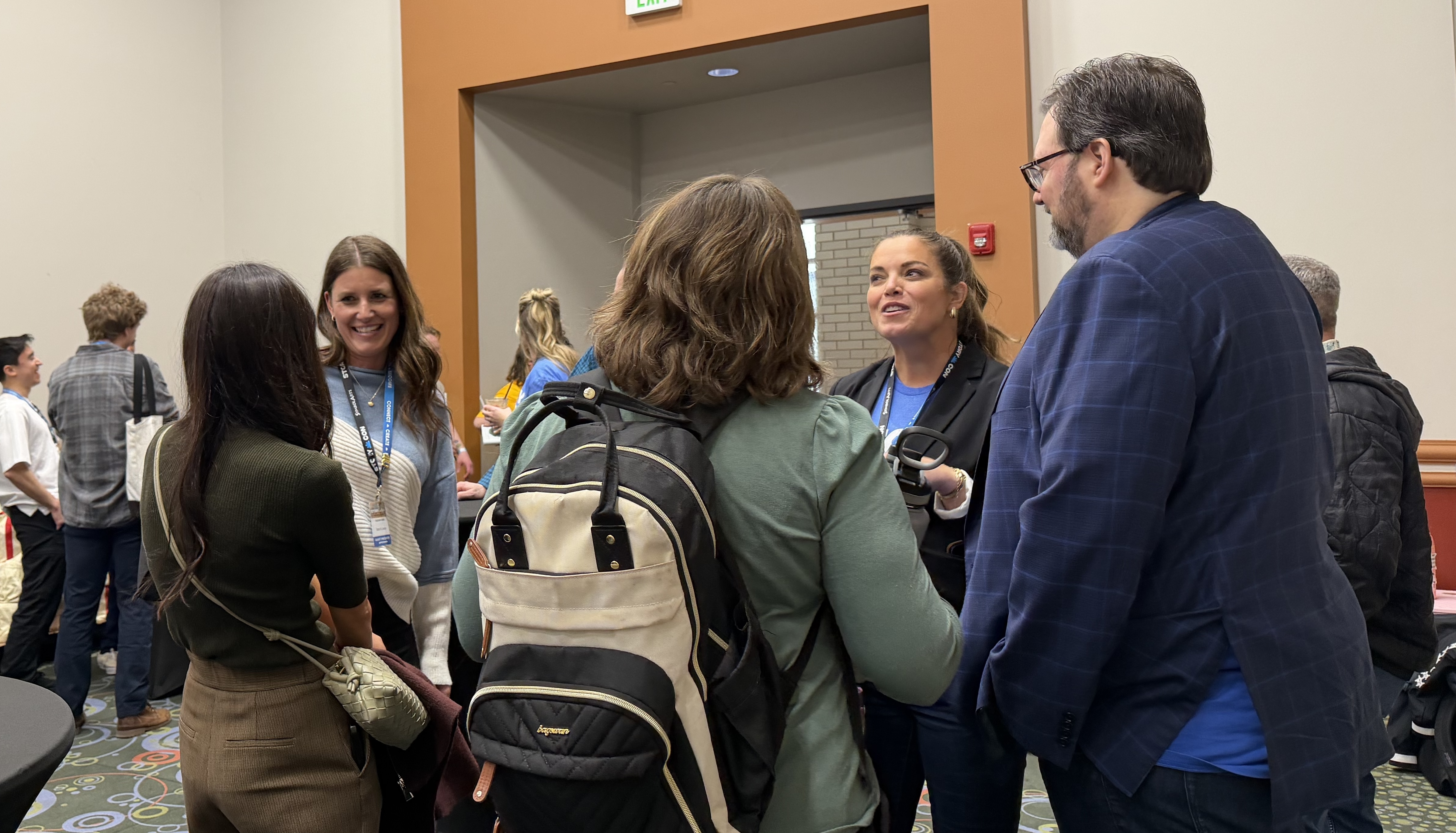 Authors Sara B. Larson and Brandon Sanderson speak to StoryCon CEO Jennifer Jenkins at a meet and greet during the 2026 StoryCon literacy convention in Salt Lake City, Saturday.