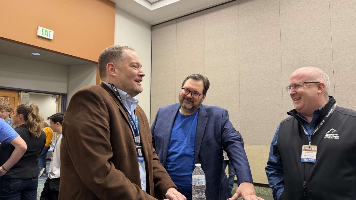 Authors Brandon Mull and Brandon Sanderson chat during a meet and greet at the 2026 StoryCon literacy convention in Salt Lake City, Saturday.