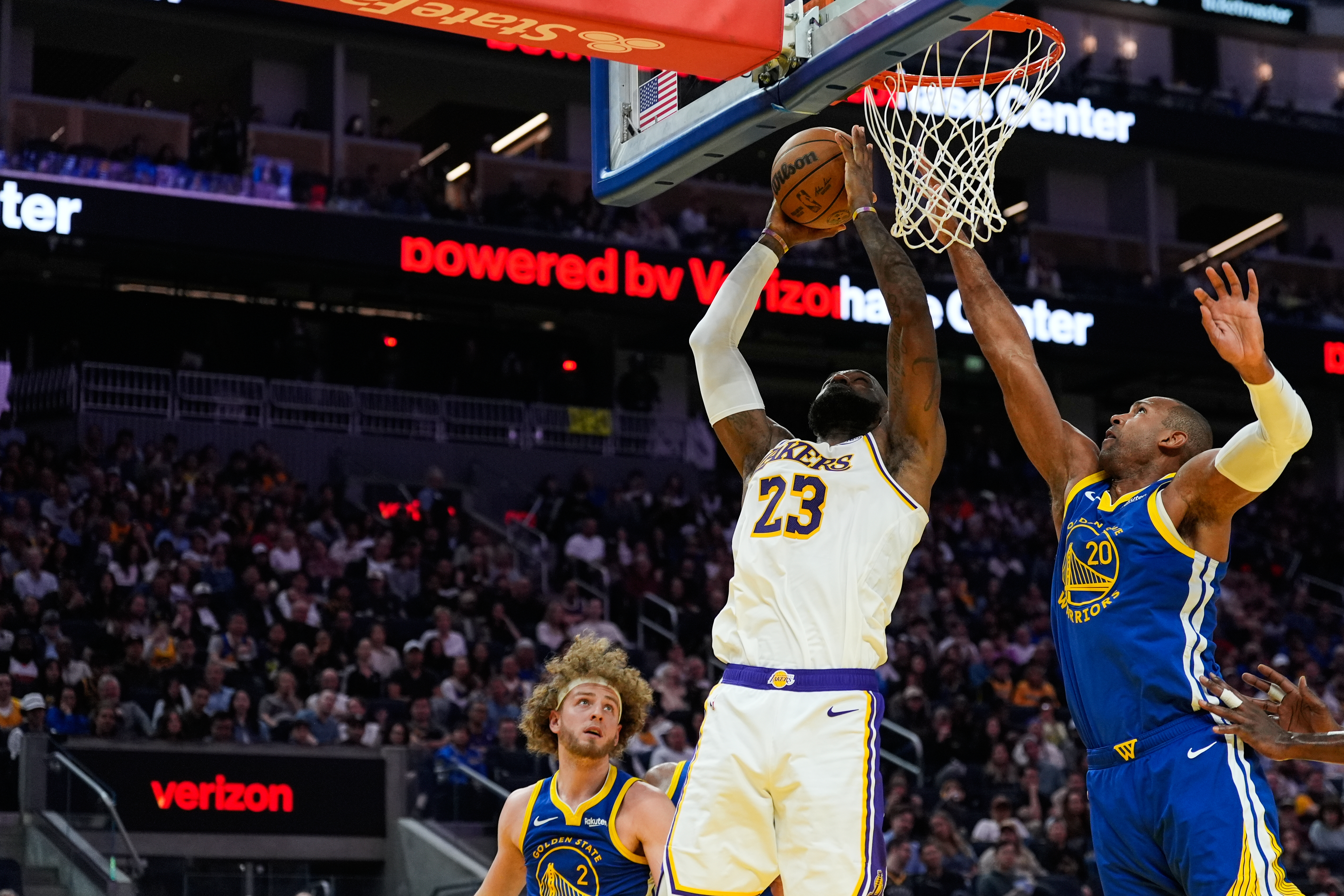 Los Angeles Lakers forward LeBron James (23) shoots while defended by Golden State Warriors center Al Horford (20) during the first half of an NBA basketball game, Saturday, Feb. 28, 2026, in San Francisco. 
