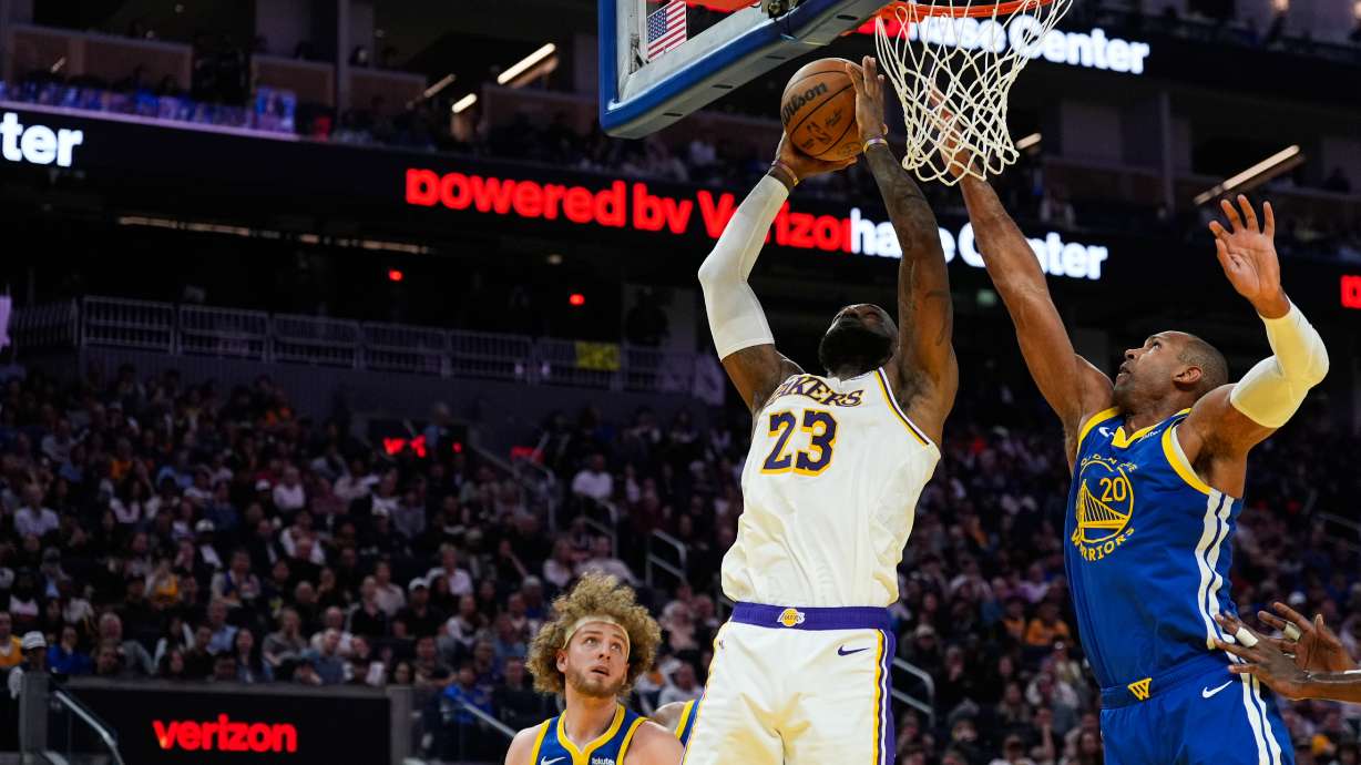 Los Angeles Lakers forward LeBron James (23) shoots while defended by Golden State Warriors center Al Horford (20) during the first half of an NBA basketball game, Saturday, Feb. 28, 2026, in San Francisco.