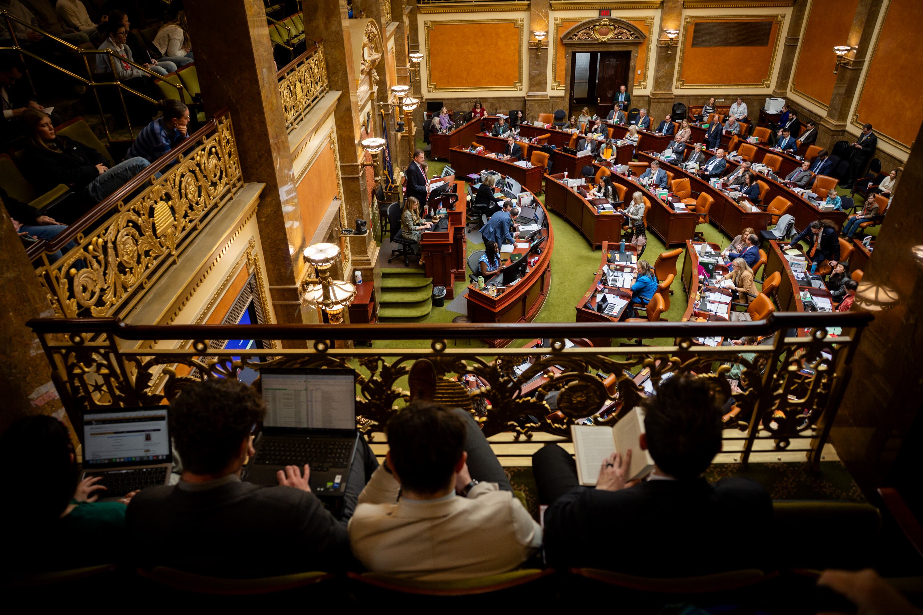 People watch representatives gathered in the Utah House of Representatives Chamber during the legislative session at the Capitol in Salt Lake City on Feb. 24.