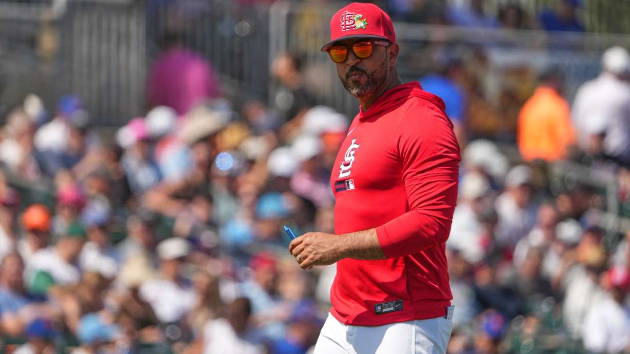 St. Louis Cardinals manager Oliver Marmol walks back from the mound after making a pitching change during the second inning of a spring training baseball game against the New York Mets Friday, Feb. 27, 2026, in Jupiter, Fla.