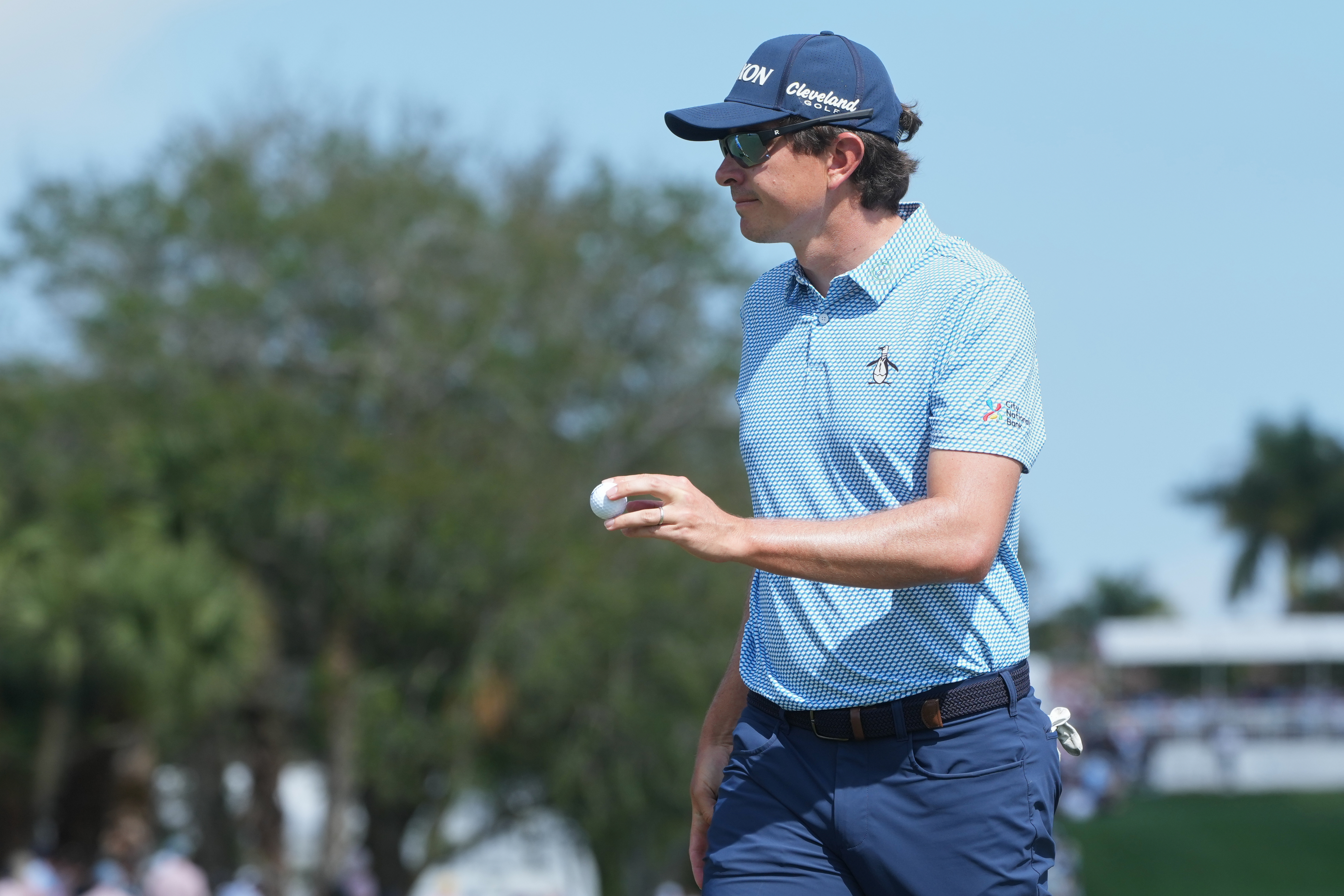 Nico Echavarria of Colombia show his ball on the first green during the final round of the Cognizant Classic golf tournament, Sunday, March 1, 2026, in Palm Beach Gardens, Fla. 