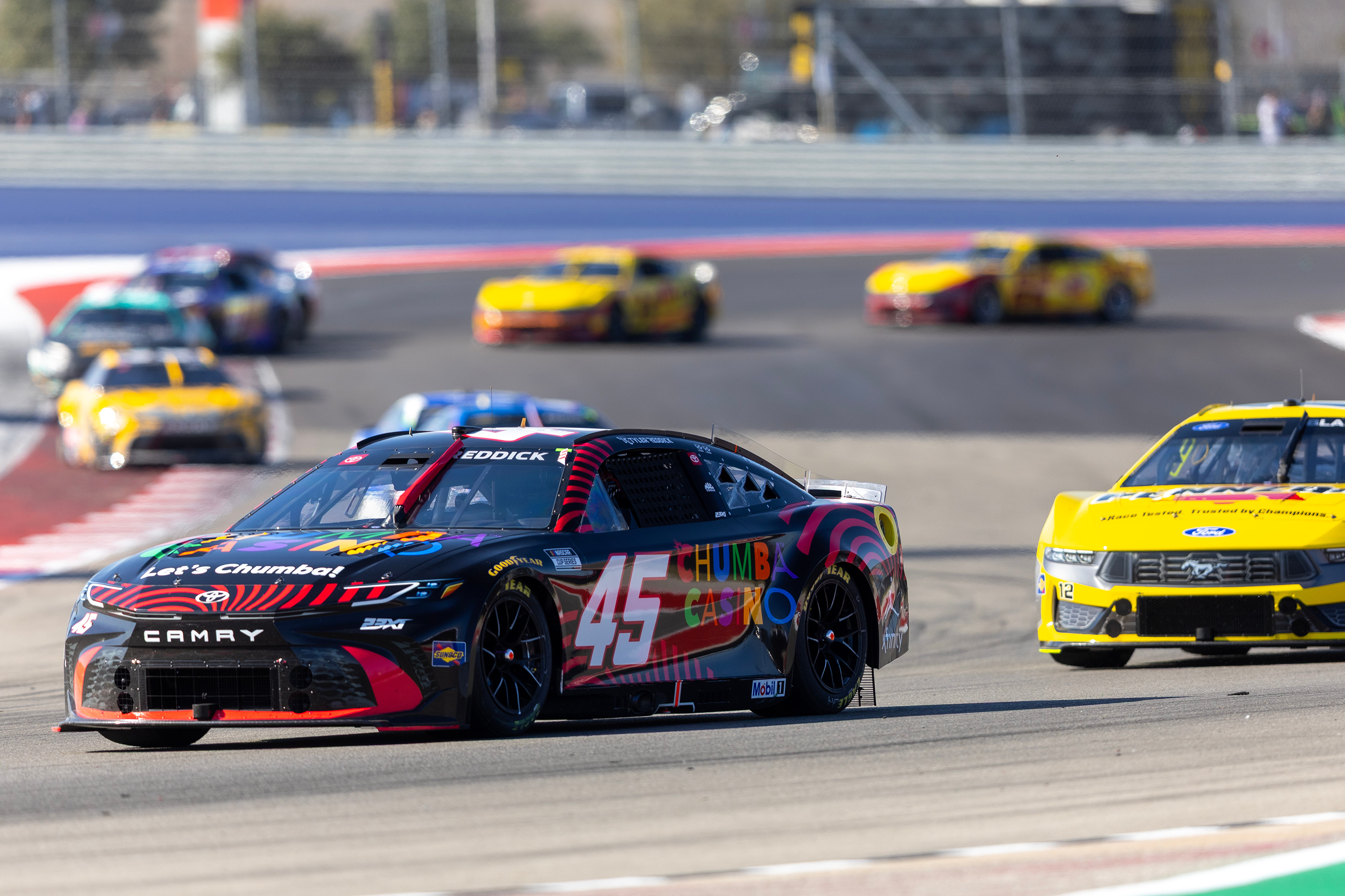 23XI Racing's Tyler Reddick (45) and Team Penske's Ryan Blaney drive through Turn 13 during a NASCAR Cup Series auto race in Austin, Texas, Sunday, March 1, 2026. 