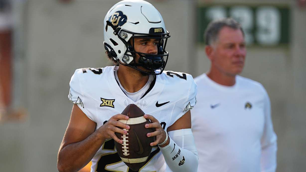 FILE - Colorado quarterback Dominiq Ponder (22) warms up before an NCAA college football game Sept. 14, 2024, in Fort Collins, Colo.