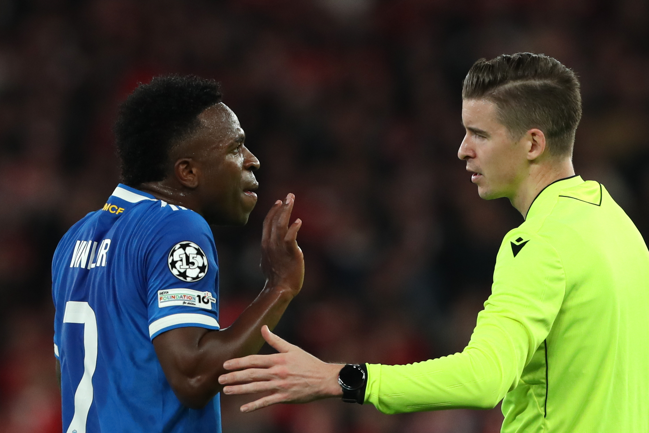 Real Madrid's Vinicius Junior argues with referee François Letexier after scoring the opening goal during a Champions League playoff soccer match between SL Benfica and Real Madrid in Lisbon, Portugal, Tuesday, Feb. 17, 2026. 