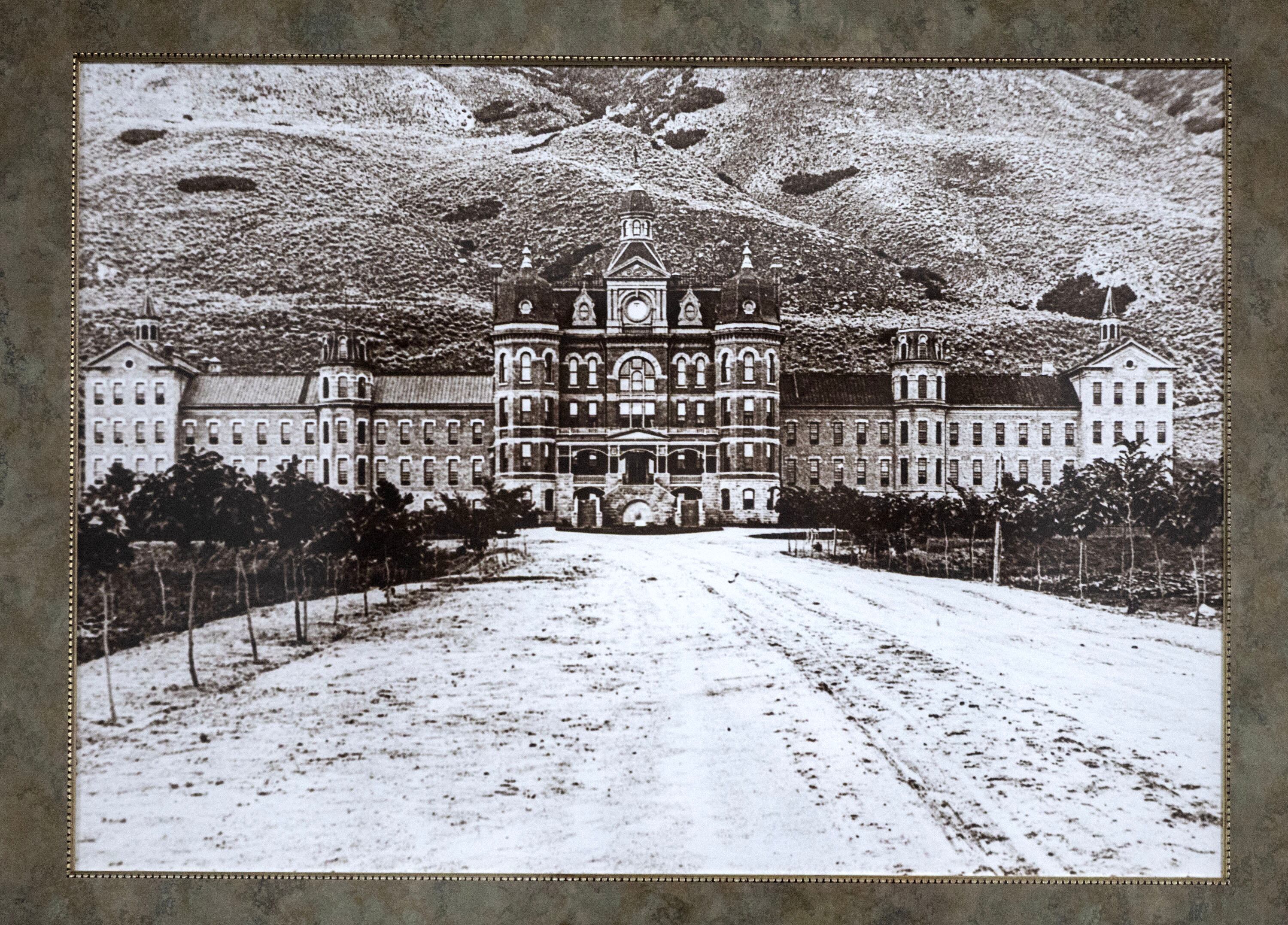 A historical photo of the Utah State Hospital is displayed at the hospital in Provo on Feb. 17, 2026. The Utah State Hospital was called the Territorial Insane Asylum in 1885.