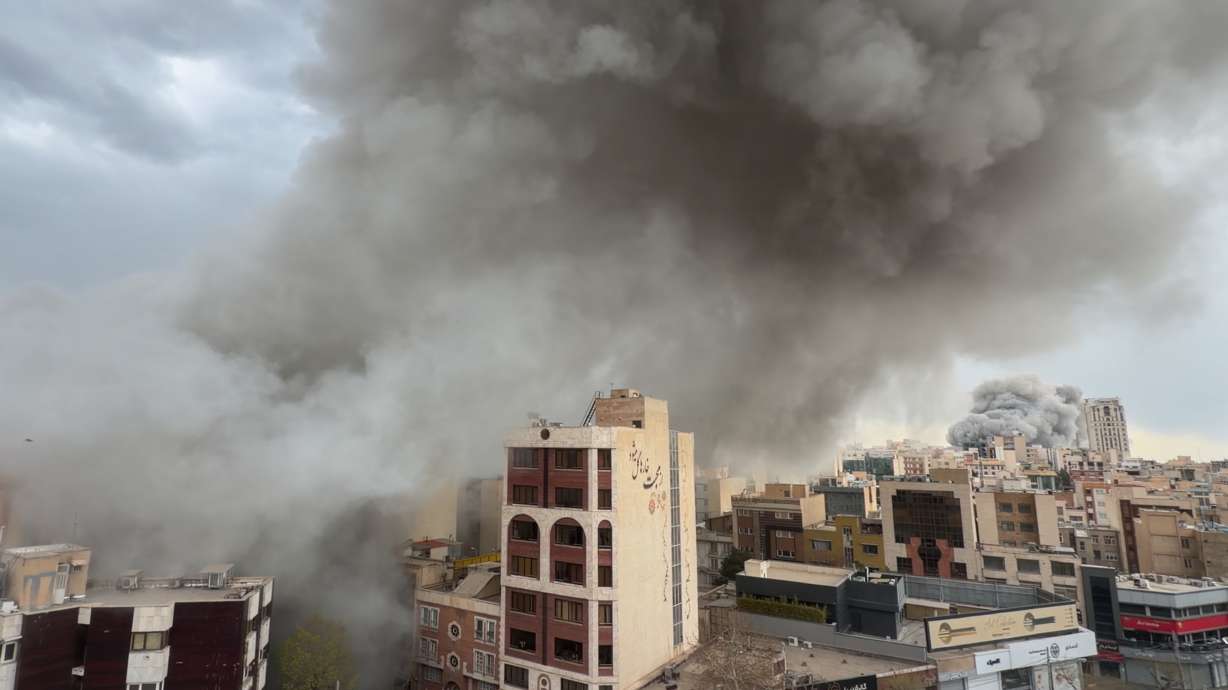 Smoke from simultaneous strikes rise over Tehran, Iran, Monday. Utah Rep. Mike Kennedy supports President Trump’s military incursion, but said Congress needs to be involved to ensure this does not become a “long-term protracted” conflict.