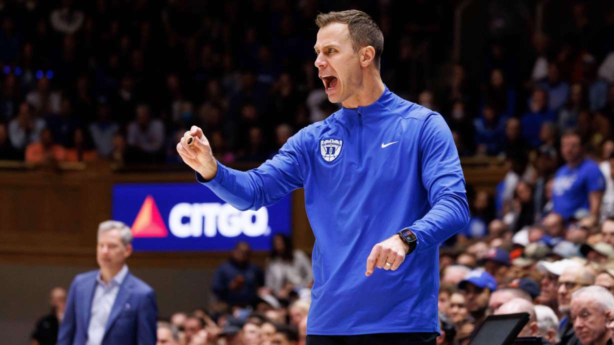 Duke head coach Jon Scheyer shouts towards the court during the second half of an NCAA college basketball game against Virginia in Durham, N.C., Saturday, Feb. 28, 2026.