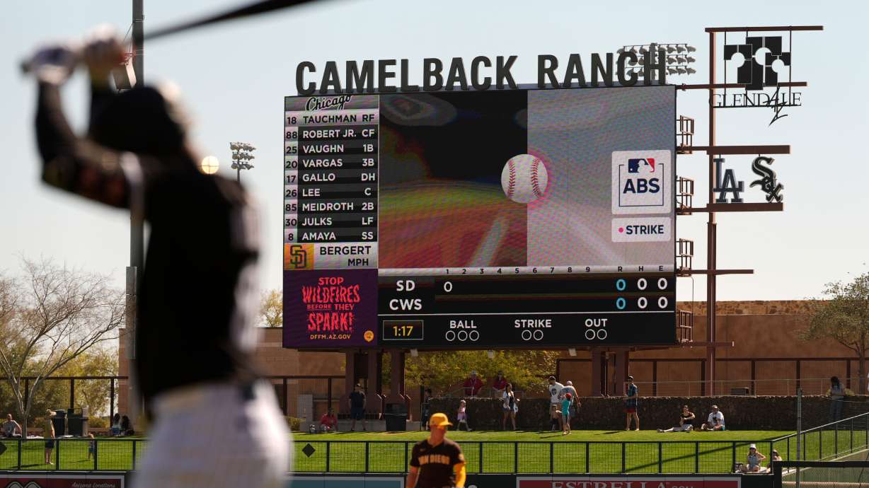 FILE - The Automated Ball/Strike System plays on the scoreboard after a pitch call was challenged during the first inning of a spring training baseball game between the Chicago White Sox and the San Diego Padres, Feb. 26, 2025, in Phoenix.